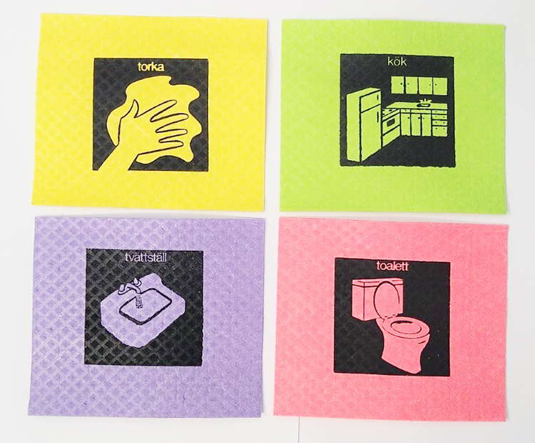 Fyra disktrasor med illustrationer av hand som torkar, kök, tvättställ, toalett
